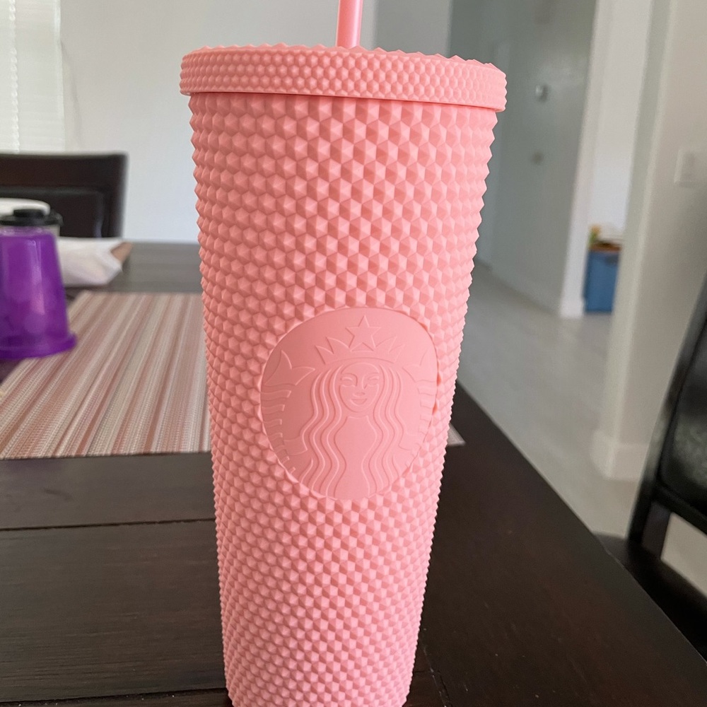Pink studded Starbucks cup